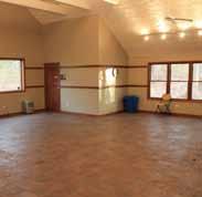 The main building offers one large room that can either accommodate up to 80 guests in a single space or be divided into two smaller rooms seating 40