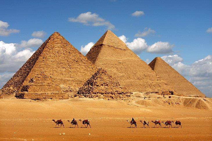 Pyramids The Egyptians honored their pharaohs in a special way: they built great tombs called pyramids. These enormous structures were made of stone, and still tower over the desert lands.
