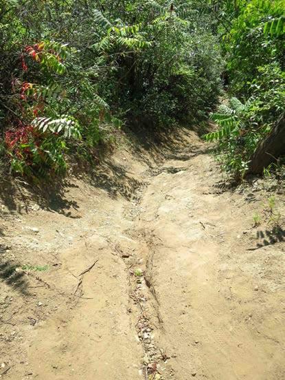 On poorly aligned steep and/or fall-aligned trails the potential for unmanaged water volume and velocity along the trail s tread leads to erosion of the tread, cupping and decreased utility for trail