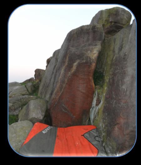 Stead Crag East 1/ Midge Free World 5 Start sat at the very back of the cave. Swing along the subterranean rail to emerge into the daylight. Press out and gain the top of the capping block.