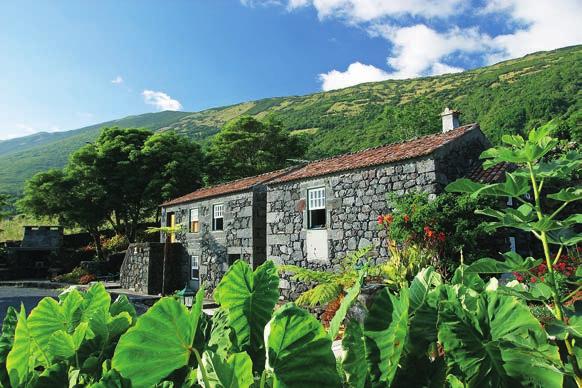 twelve traditional stone houses of Adegas do Pico are located in the fishing village of Prainha and enjoy panoramic views over the ocean and surrounding countryside.