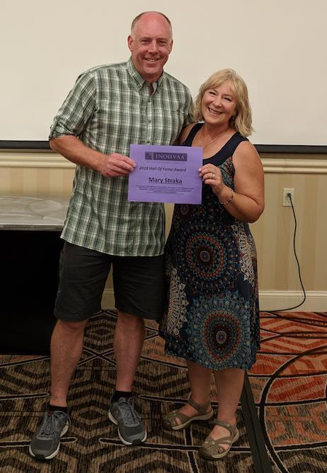 Mary Straka received the Hall of Fame Award from Chris Gamache, INOHVAA Chair. Photo courtesy of NOHVCC.