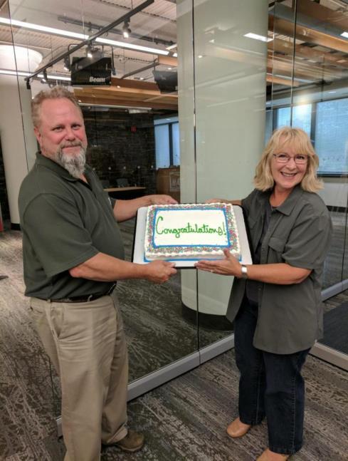 A cake at the quarterly meeting of ATVAM and the DNR, was presented to congratulate ATVAM and Mary Straka on their national awards. Photo by Ken Irish.