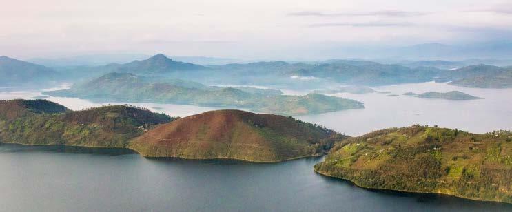 HISTORY OF RWANDA Rwanda is a land of sprawling lakes, cultivated green hills and smoking volcanoes made famous by Gorillas in the Mist.