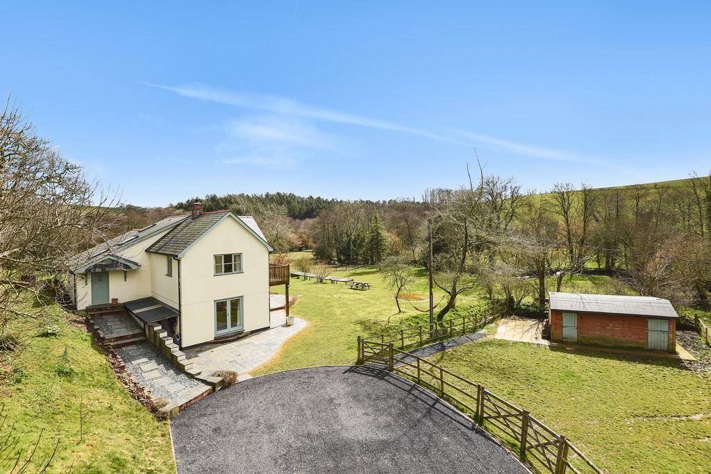 has been taken to create a home with the warmth and character one would expect from a classic farmhouse with features such as reclaimed timber internal doors and oak flooring.