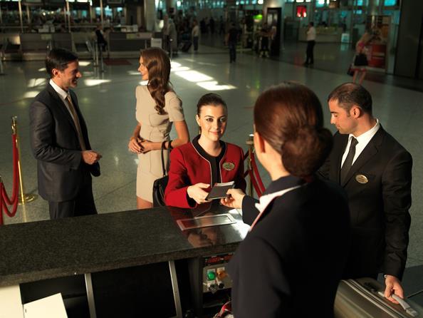 Check-in procedures are completed by primeclass Agent in