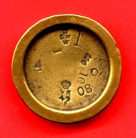 A 4oz brass weight with marks for the North (No. 1) division.