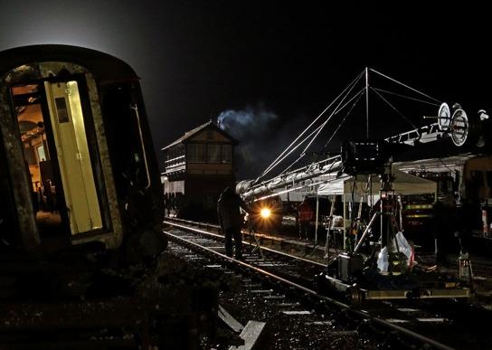 Further coaches were then brought on site with a Class 27 diesel locomotive, D5401, to compose the picture of a train travelling at speed and then the coaches derailing.