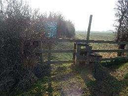 further restrictions below NT703313 Junction with road to Roxburgh Mill Wooden step stile over fence No