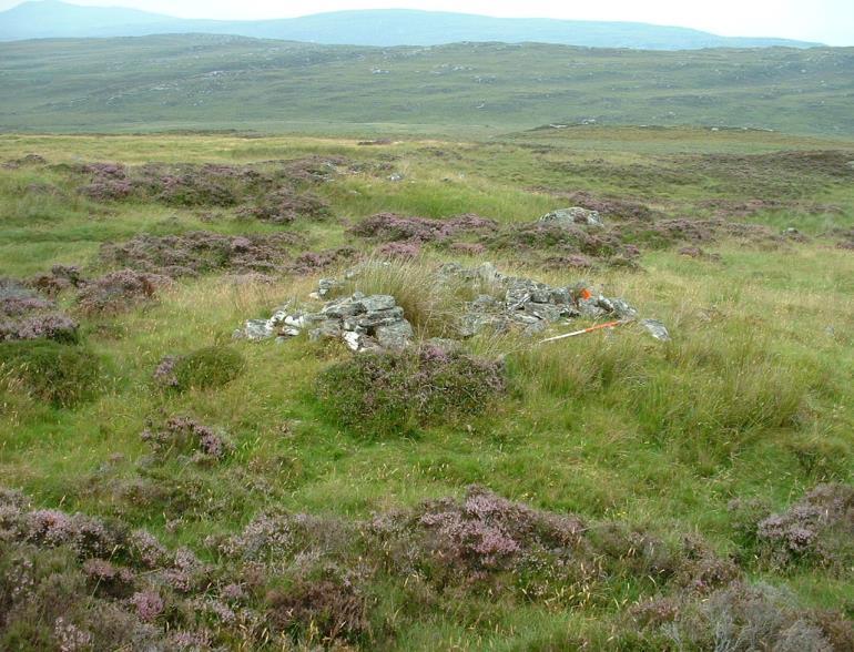Sheiling 17 - NH 40306 47933 The substantial remains of a square stone built structure measuring 2m x 2m internally are on the summit of a small knoll. The walls are roughly constructed of stone 0.