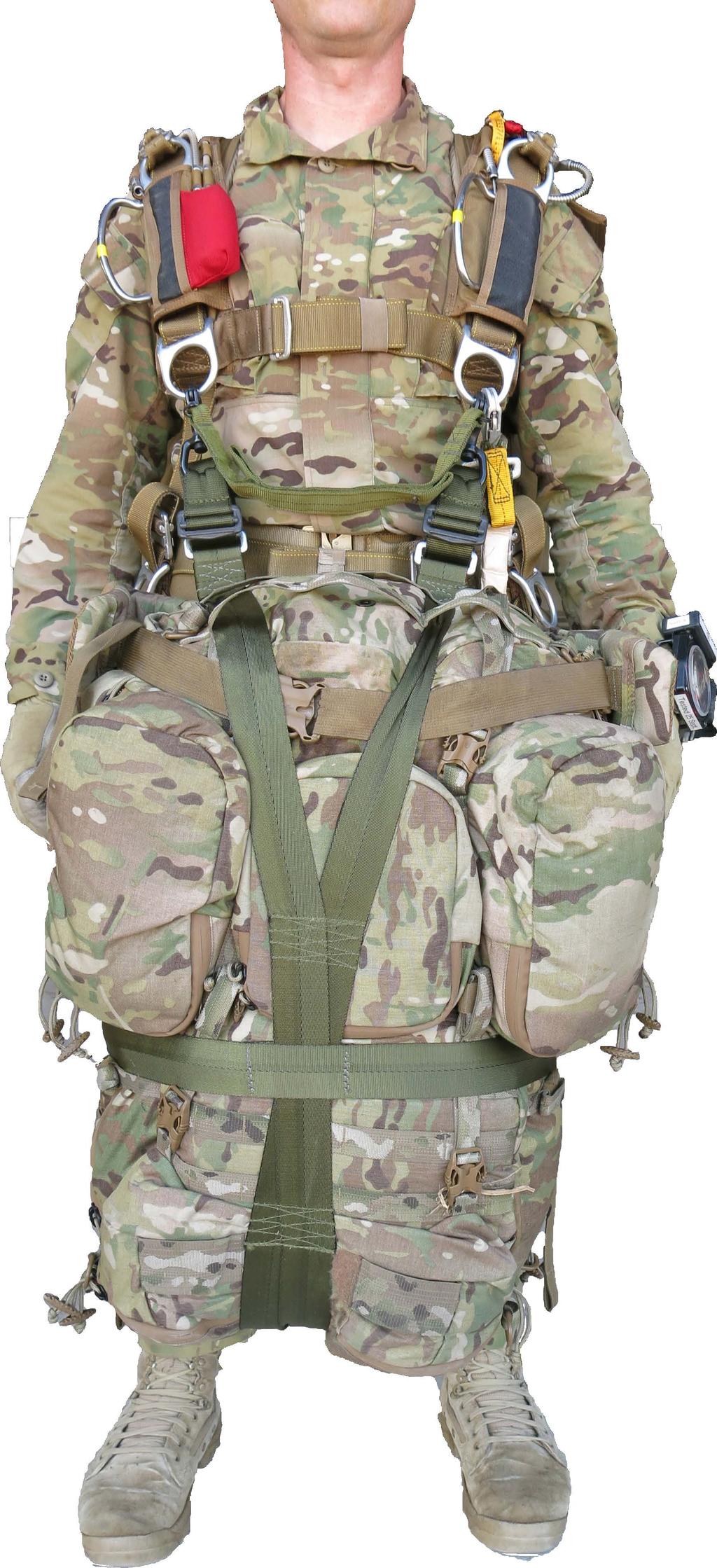 CONNECTING THE PACK TO THE PARACHUTE HARNESS The parachutist stands facing the rigged combat pack and steps through the pack shoulder straps.
