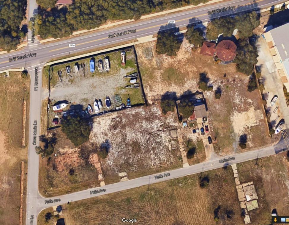 The land area on the waterfront parcel is approximately 1.27 acres, and the non-waterfront parking site for the dry storage buildings totals 30,061 square feet or 0.7 acres. The commercial highway parcel lies in the southeast corner of Gulf Beach Highway and Casa Marina Lane.
