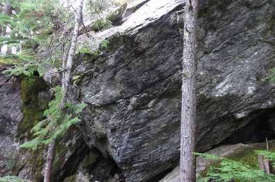Sit start at the left of the upstream face with left hand in the crack and climb this to the top. (Not pictured). 5) V0 Climb the arete from a crouch. (Not pictured). 6) Project The tall downhill face has a narrow flat block for a landing.