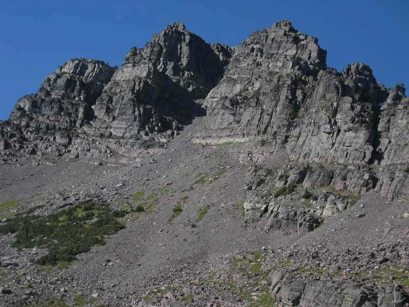 The following information on this great peak is extracted from Climbers Guide to Montana and used with permission from its author (and TRM member) Pat Caffrey: The west side of Gray Wolf. F.