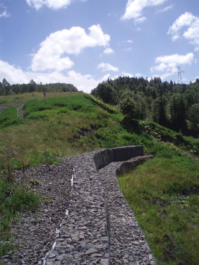 The works included stabilization of the side slope using gabion walls and