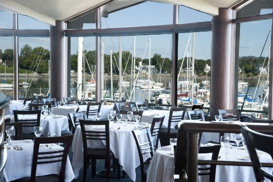 Top Floor White Table Cloth Fine dining Overlooks marina, ferries,