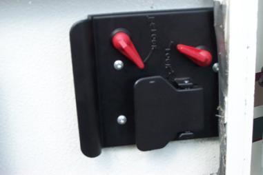 Door locks - The inside of the camper door has 2 red locking switches.