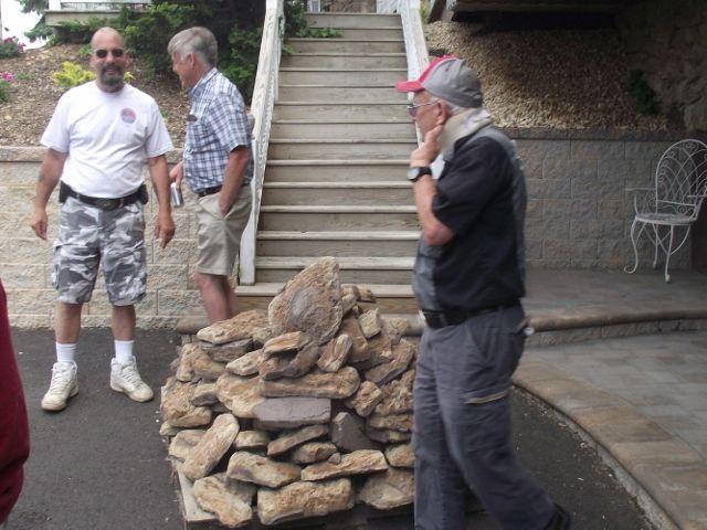 Greg, Ken W. and Les consider the pallet of rocks for sale at one of the quilt shops on our Amish tour.