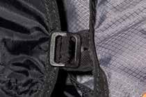 It is attached to four loops under the seat of the harness, and one Velcro closure that wraps around the lower leg-spread adjustment strap, with the intake facing forwards.