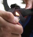 After cutting, you can seal the end of the strap by briefly touching it with the flame of a lighter.