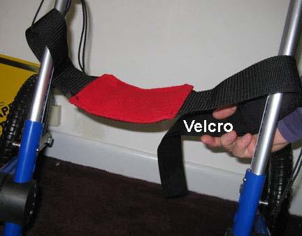 Loop the strap over the railing and attach the Velcro under the dog s belly.