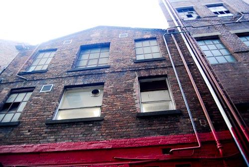 with historic signage and fire escapes.