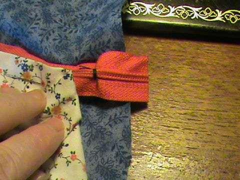 Sew across the zipper to stop the zip from going to