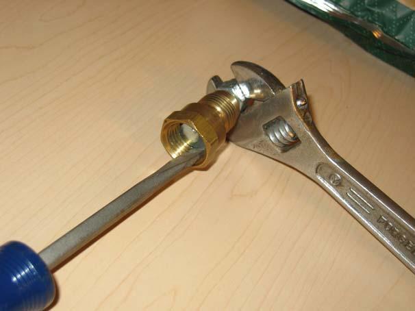 For the monopod mount assembly, use a wrench (or adjustable wrench) on the nylon-insert lock nut, and hold the bolt in place with a large flathead screwdriver.