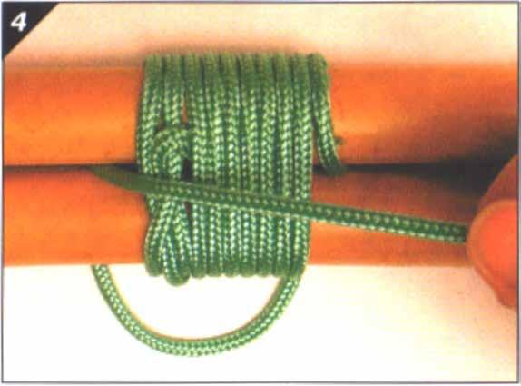4. The lashing is finished with a clove hitch around both poles or a couple of frapping turns by bringing the end of the rope between the