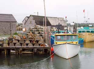 community of Peggy s Cove. Set on a narrow, coastal inlet characterized by wave-worn granite boulders and crashing surf, this charming little village is perhaps Canada s most photographed site.