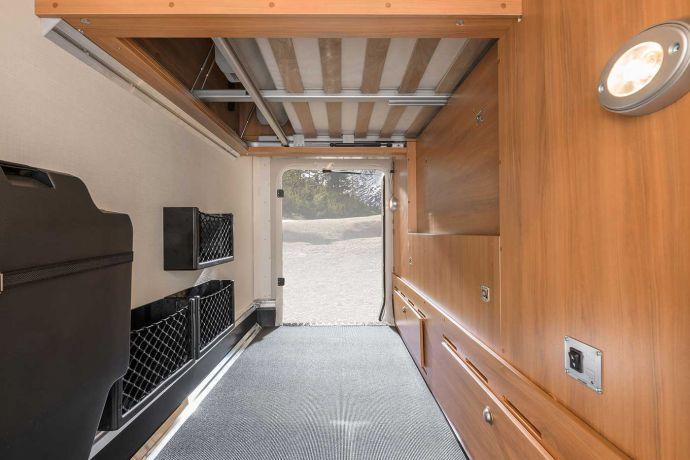 Garage doors headroom Payload The queen-size bed in the rear of the HYMER TClass SL 708 is available in a high or low-level version, which means that the two standard garage doors