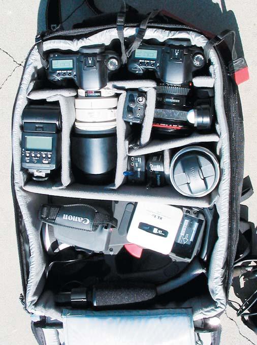 A traditional arrangement splitting the backpack into three vertical sections. Photo: Brian Cassey/ www.briancasseyphotographer.com.au Note the Nikon 300 2.8 located in the lower right hand corner.