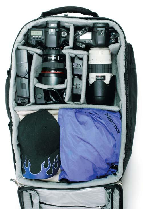 Note the flash is put in vertically at the lower right corner. The entire backpack does NOT have to be filled up entirely with gear. Shown: with gear above and clothes below.