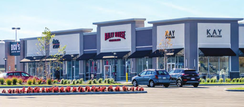 The mixed-use development includes a power center, grocery anchored strip center, outparcels and an office building.