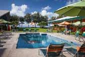 KAUAI SHORES HOTEL Set oceanfront on a mile-long stretch of Kauai s Coconut Coast, here guests enjoy newly remodeled guestrooms and public areas, a new pool deck and hot tub, and a wide range of