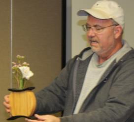 SHOW SAND TELL Jon Cash talked about saw stop technology. Mike Oshry made a steam bent flower vase using beech and iroku ( cheep teak ) and a large trivet.
