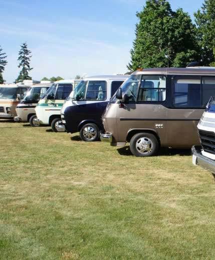 A row of exotic 1970s GMC motorhomes owned by members of the GMC Cascaders club.