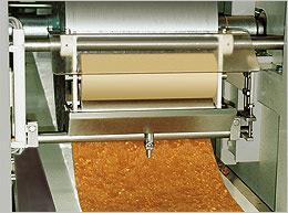 Conbar roller former Type WEZK caramel or fudge mixed with nuts, raisins, cereals and so on, are often formed into single or double layer bars.
