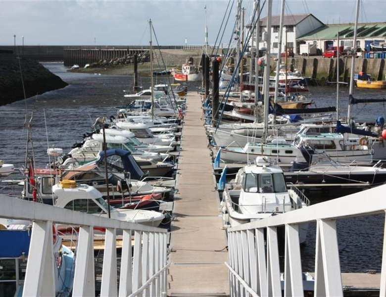 SUMMARY One of the finest and best developed coastal marinas in Wales 150 berths, all on Walcon pontoons with connections to mains services Dry standing area with large slipway Extensive facilities
