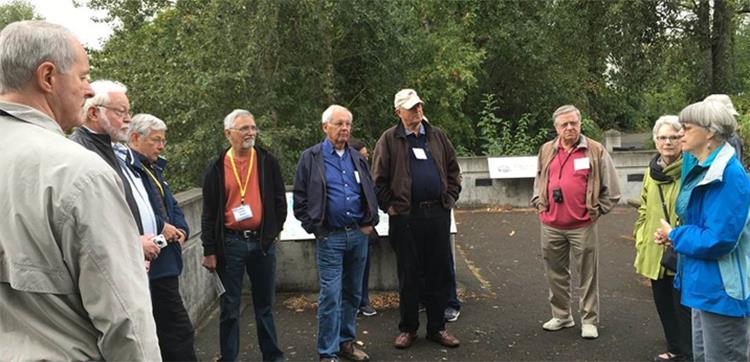 Michelle Girts (right) describes the Marine Park Natural Resources Area At the same time, another alumni group visited several projects near the Portland office.