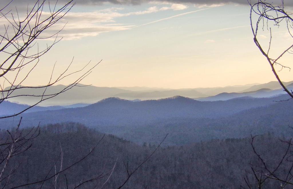 This southwest view over Dick s Mountain shows the double-peaked Bill s Mountain in the center, with the mountains of the South Carolina Upstate along the distant horizon.