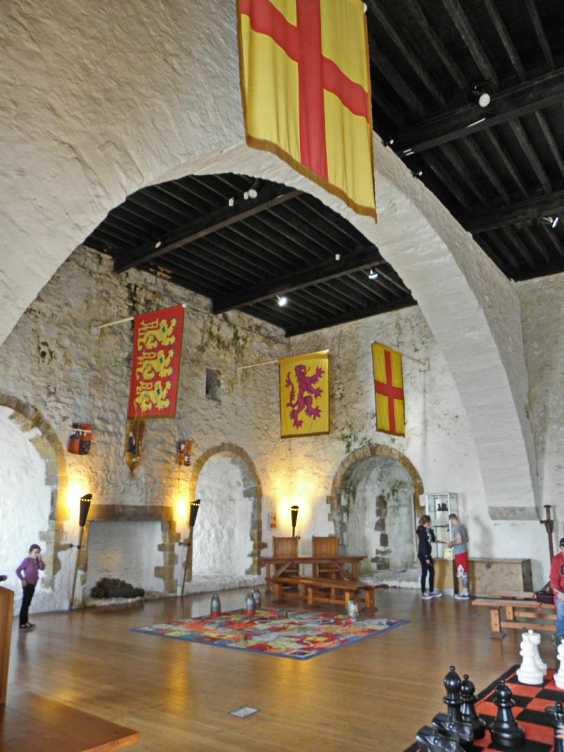 Fig. 13. Carrickfergus Castle. The great upper chamber on the 3rd floor looking toward the north-west corner.