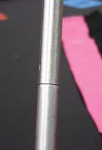 Once inserted, stand the pole up and clamp the pole to the U shaped upright leg, noting that the rounder edge of the clamp