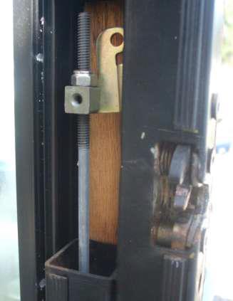 Adjust the rod on the latch which opened last as determined in the previous step.