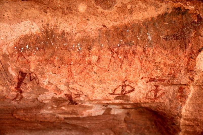 Additionally, the site contains rock paintings at 13 different locations, with depictions of humans painted
