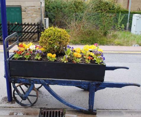 The platforms are also a blaze of colour with some more unusual planters and tubs in use.