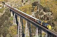 From here the train rolls across the Taieri Plains and climbs into the Taieri Gorge, a narrow and deep gorge carved out over aeons by the ancient Taieri River.