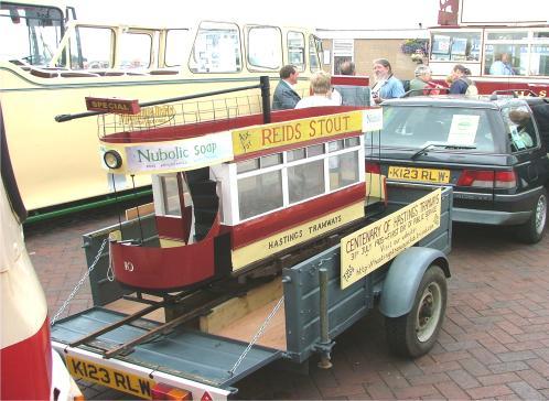 trailer, a modern Hastings Arrow bus, a Maidstone and District open top single deck Regal coach, a Maidstone and District double-decker bus and a modern Hastings Tramways Bus.