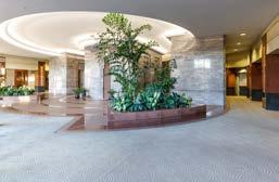 From its lovely plaza, the building invites you to enter its spacious lobby, accentuated by granite and