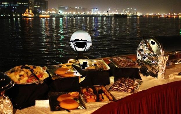 DHOW CRUISE WITH DINNER While visiting Abu Dhabi, enjoy the luxury of a buffet dinner on a traditional double decker wooden Dhow.